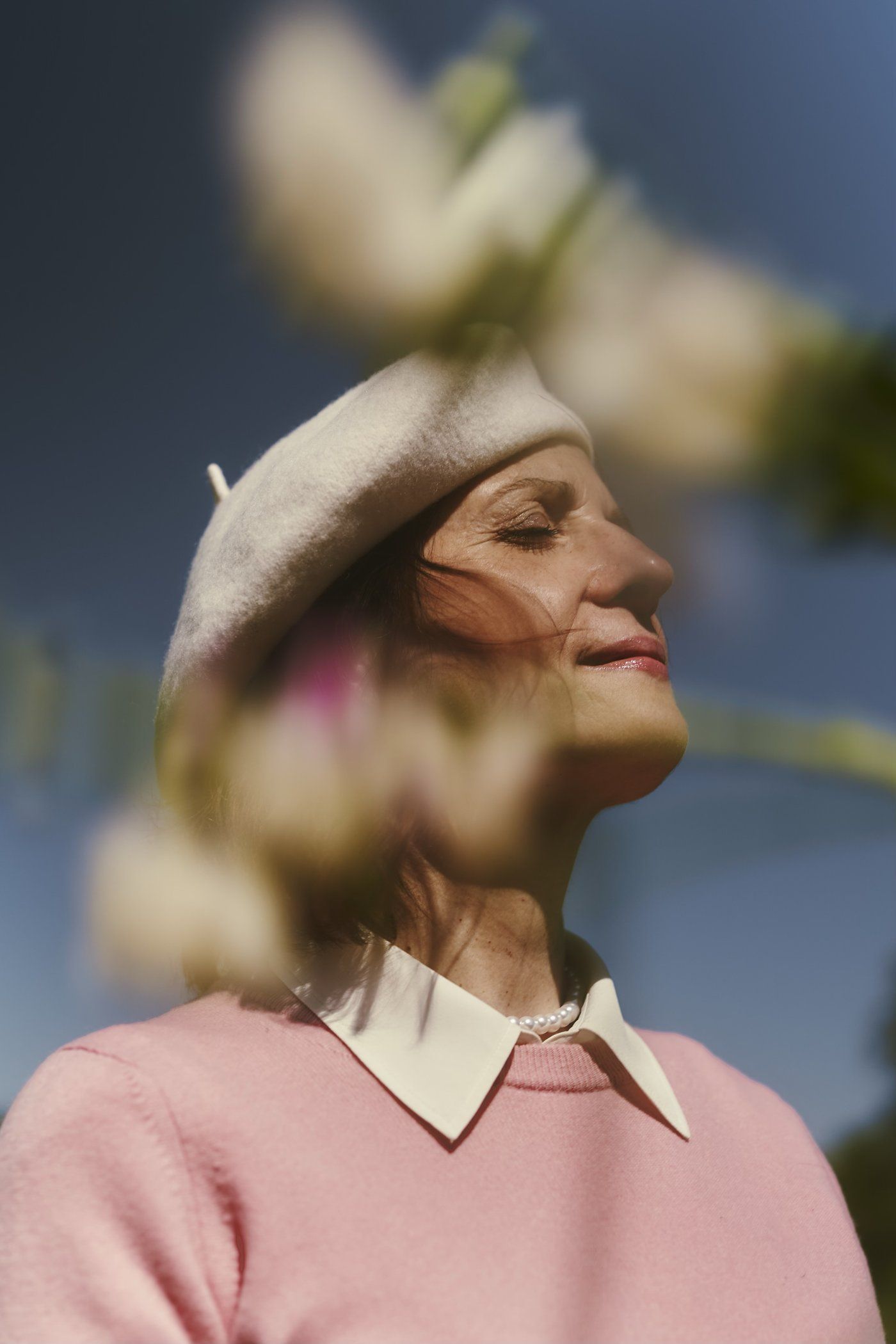 Irena Rupnik with eyes closed, smiling in the sun